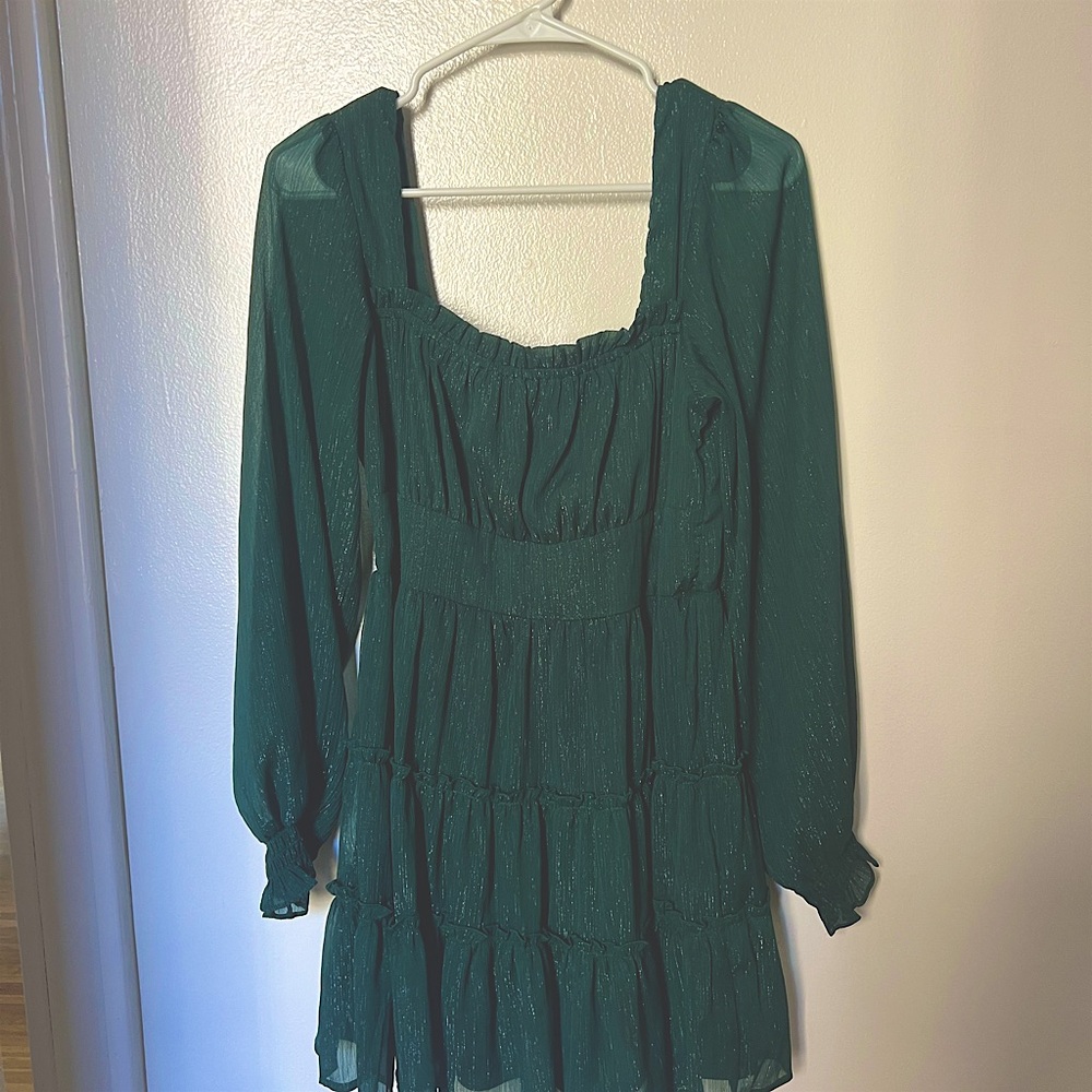 Green shimmering midi dress with ruffles and long sleeves